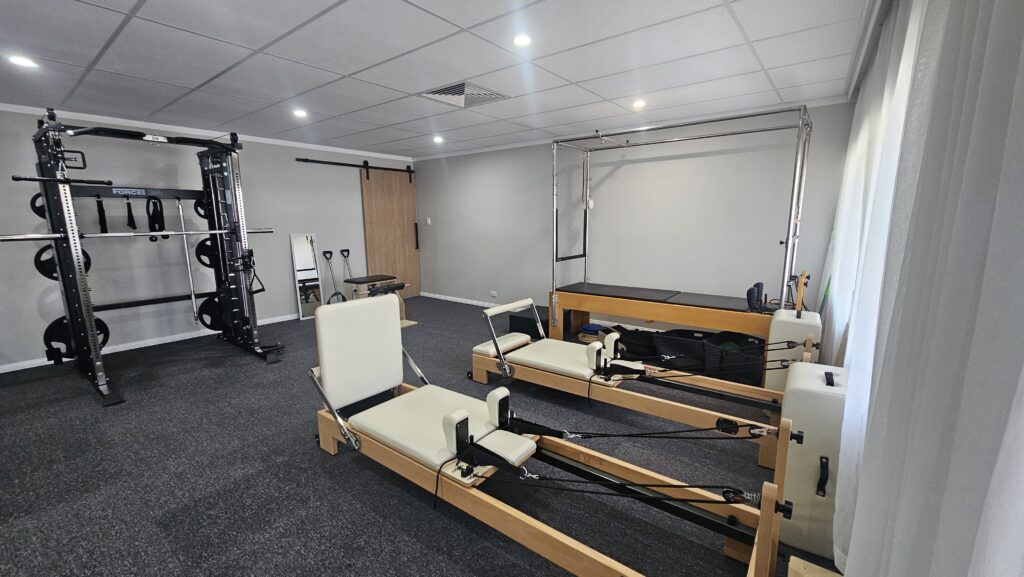Physiotherapy clinic with weights and Pilates reformers on the Gold Coast